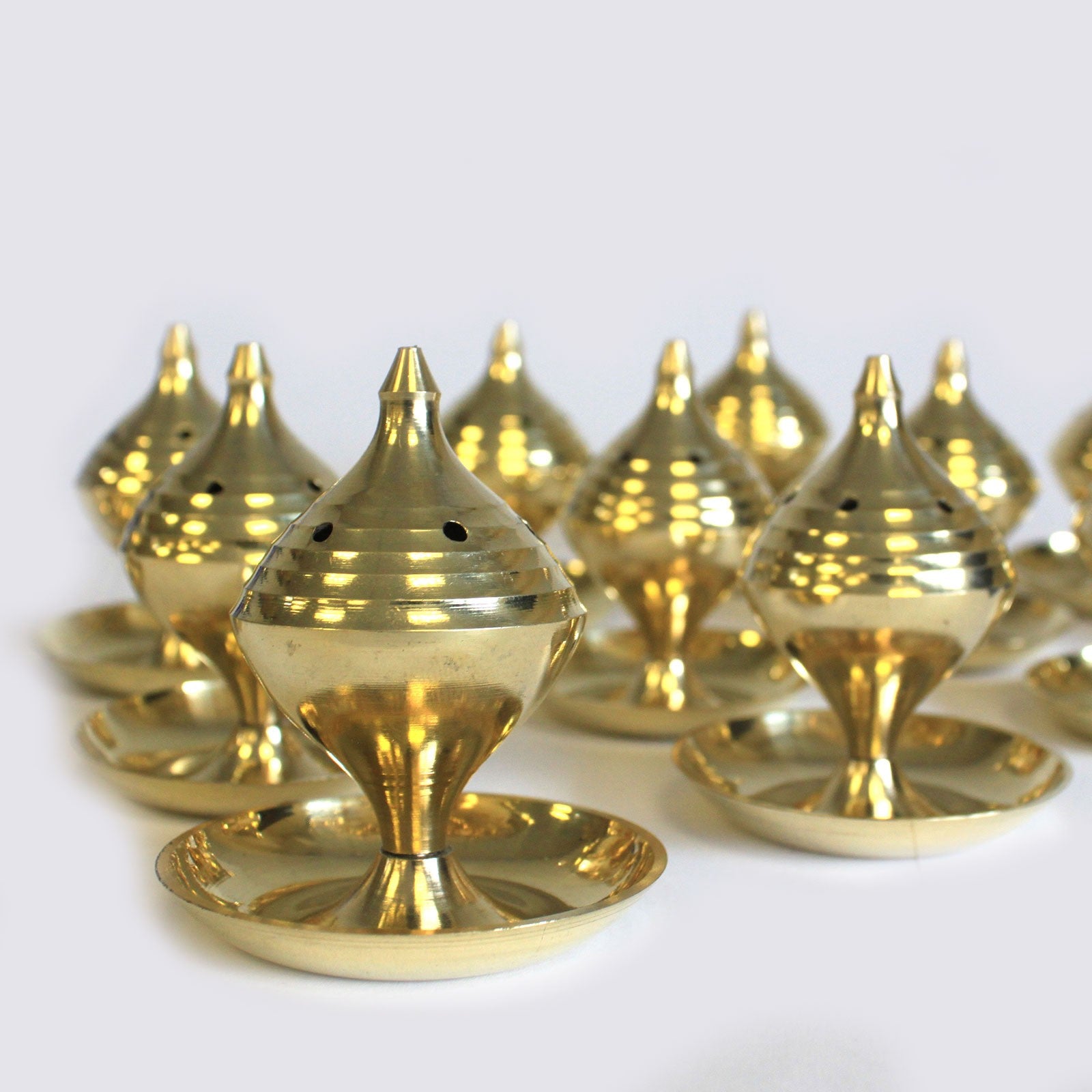 Close up image of brass incense burners