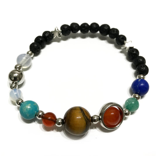 Unisex Lava Stone Bracelet - Silver Solar System on white surface. Aromatherapy lava bracelet with natural lava stones and solar system charms, one size fits all.