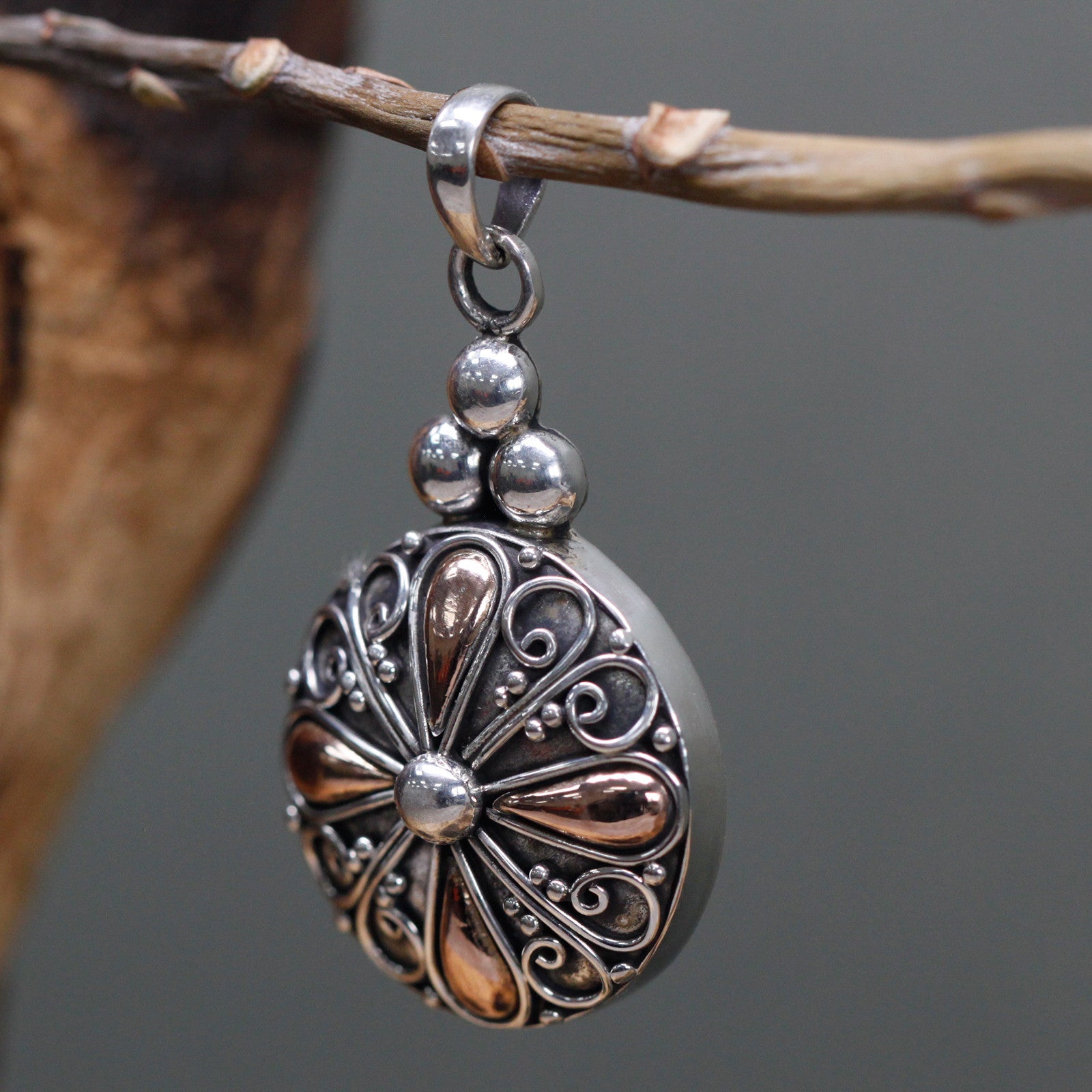 Silver and gold beautifully crafted pendant from Indonesia, showing intricate details