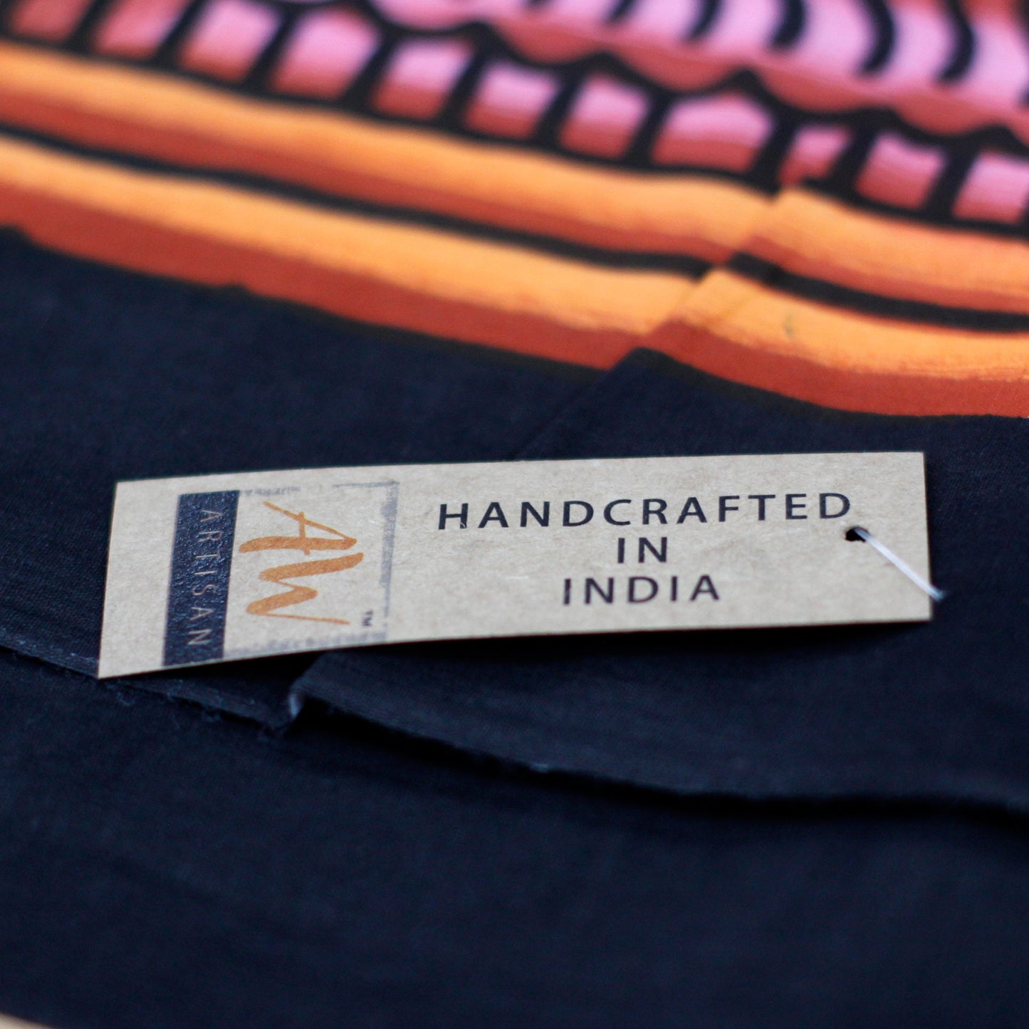 close up image of the label, stating, Handcrafted in India