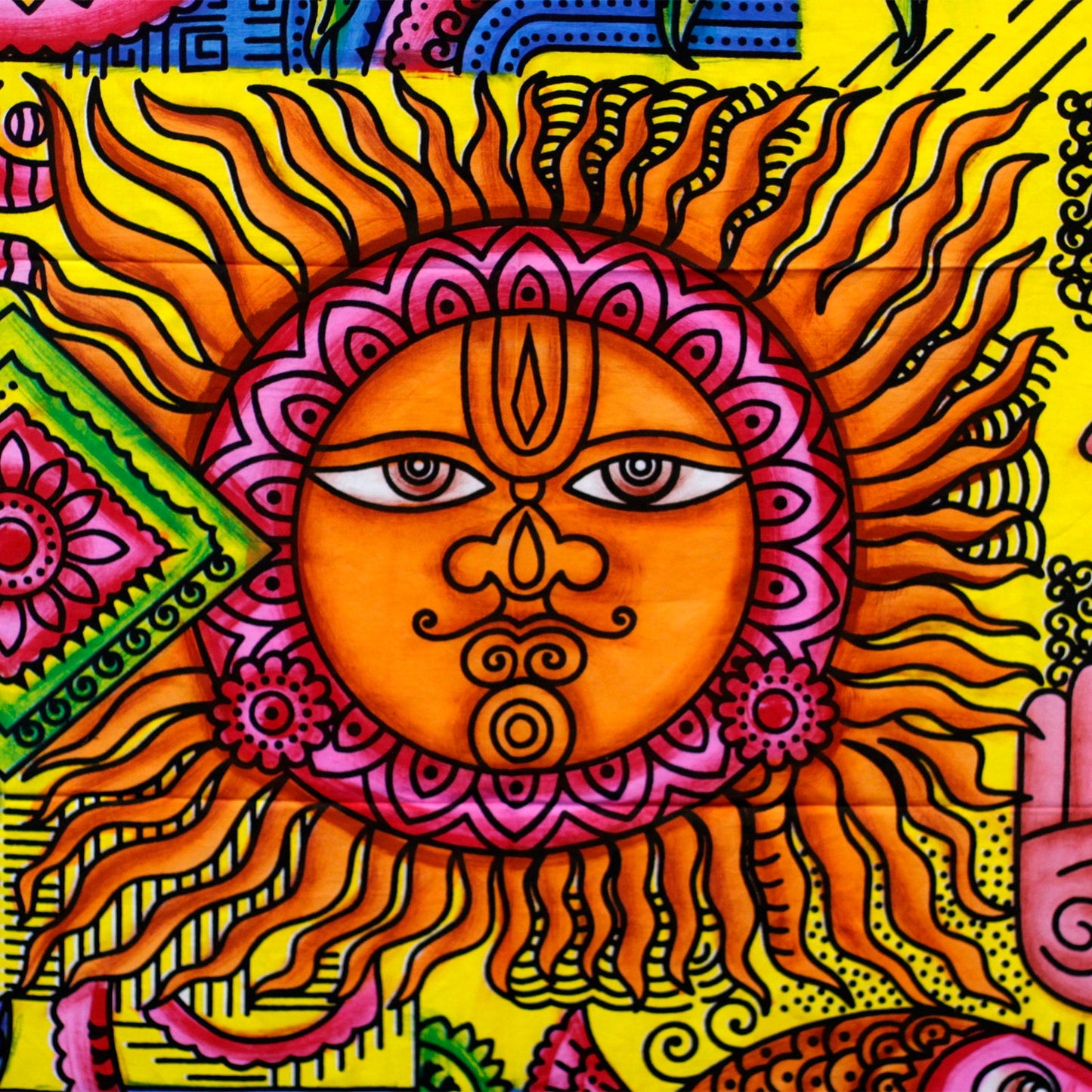 Cotton wall hanging with a vibrant sun design, handbrushed in India, measuring 115cm x 75cm. close up view of the sun face