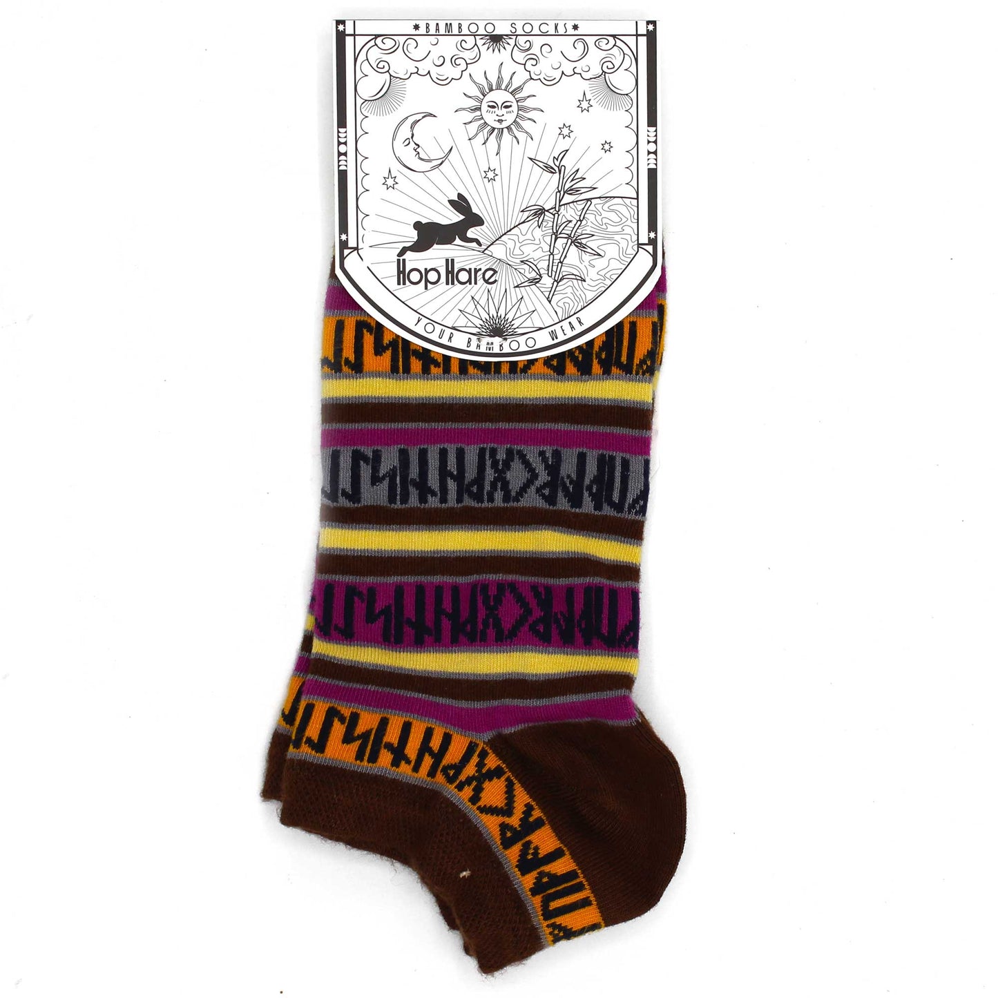 Image: single  Pair of bamboo socks featuring symbolic rune stone motifs. Stylish, sustainable, and spiritually inspired design. Showing product label attached to sock