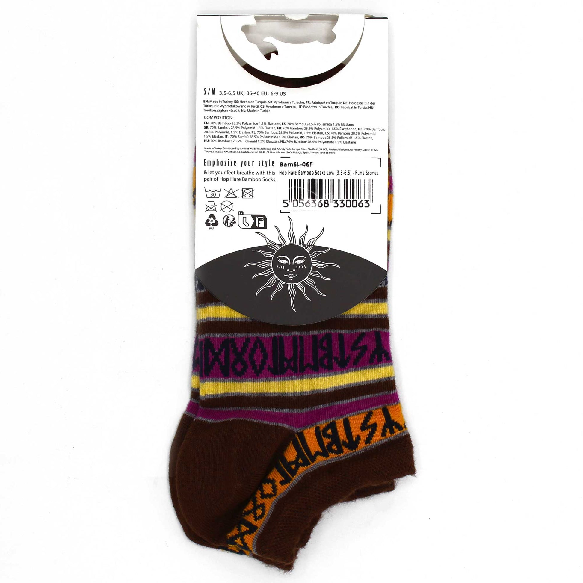 Image: single Pair of bamboo socks featuring symbolic rune stone motifs. Stylish, sustainable, and spiritually inspired design. Showing reverse of product label attached to sock