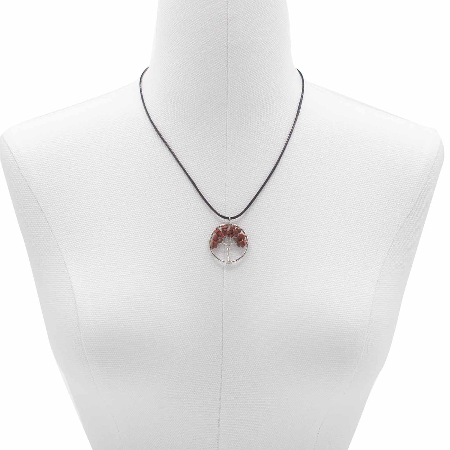 Image of a women's tree of life pendant featuring beautiful Red Jasper gemstones, symbolizing elegance and sophistication.  image on model shop bust