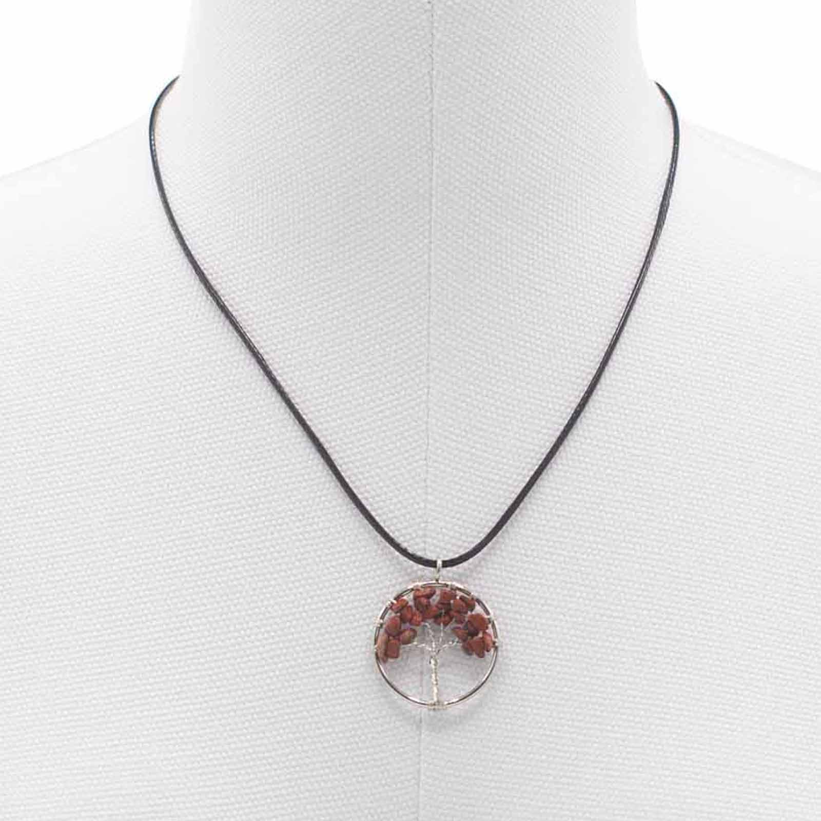 Image of a women's tree of life pendant featuring beautiful Red Jasper gemstones, symbolizing elegance and sophistication. Front close up image on model display bust.