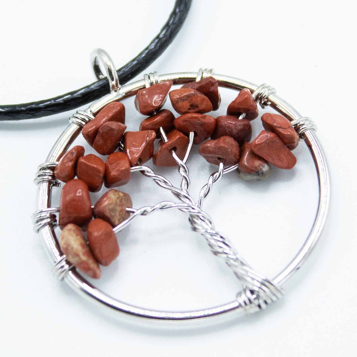 Image of a women's tree of life pendant featuring beautiful Red Jasper gemstones, symbolizing elegance and sophistication. Front  very close up image