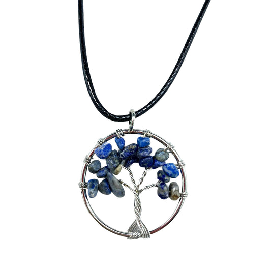 Image shows close up of beautiful tree of life pendant in sodalite.