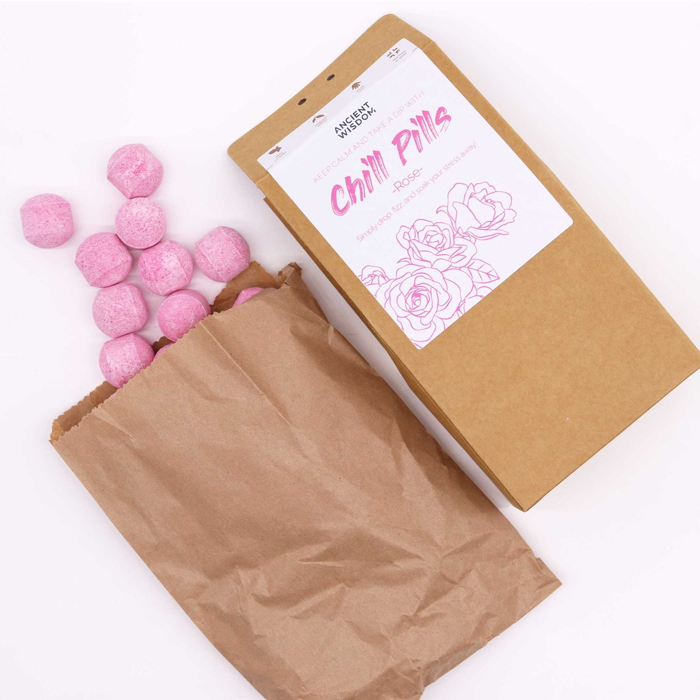 Bath bombs in packaging, loose mini bath bombs beside brown packaging 