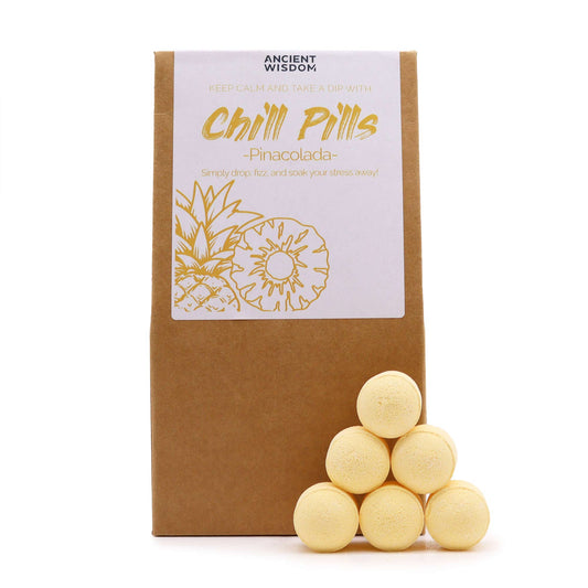 Image of 6 mini bath bombs stacked neatly next to brown packaging and fruity looking label