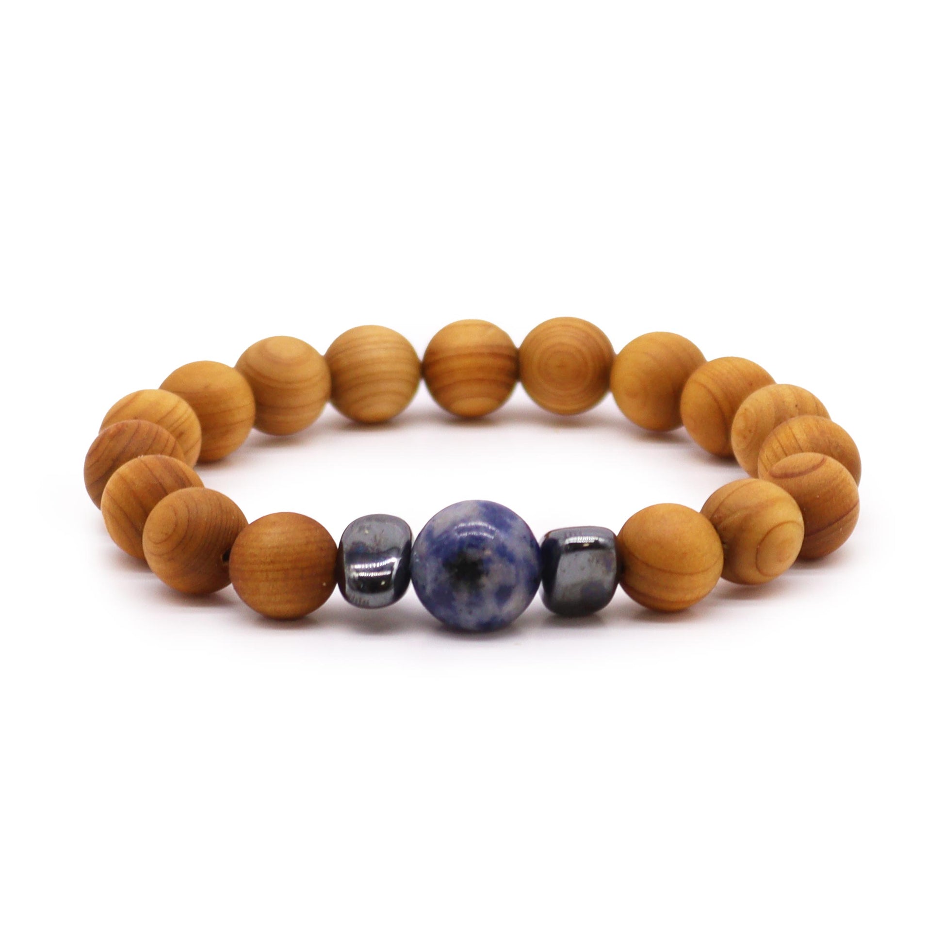 Handcrafted cedarwood throat chakra bangle with Sodalite gemstones. Eco-friendly unisex jewelry for spiritual balance. Shop now! Image of bracelet on white background