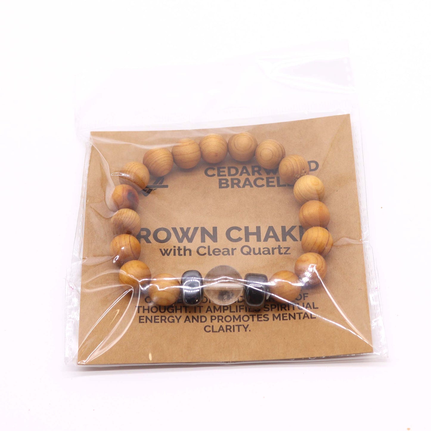 Handcrafted unisex cedarwood and gemstone bracelet with 7cm diameter, featuring natural wooden beads and vibrant gemstones, perfect for eco-friendly fashion. On white background. In packaging 