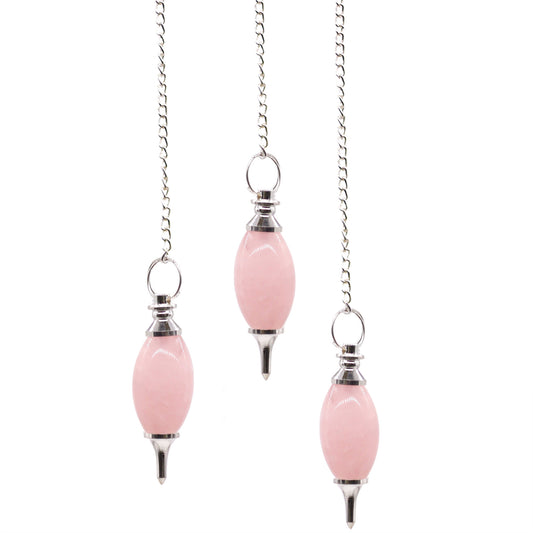 Three gemstone pendulums with silver-plated chains, featuring rose quartz crystals, against white background, dowsing, divination, healing use.