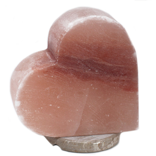 Image of heart shaped salt lamp on wooden base