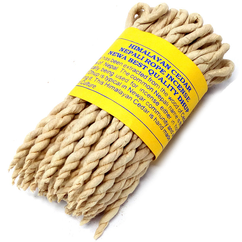 Image of a bunch of cedar rope incense on white background, hand made in nepal for relaxation home fragrance.