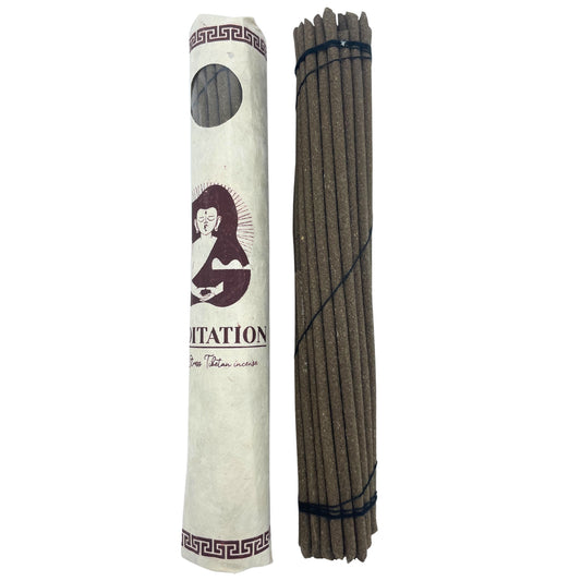 Package and incense sticks standing next to each other, representing tranquility and meditation.